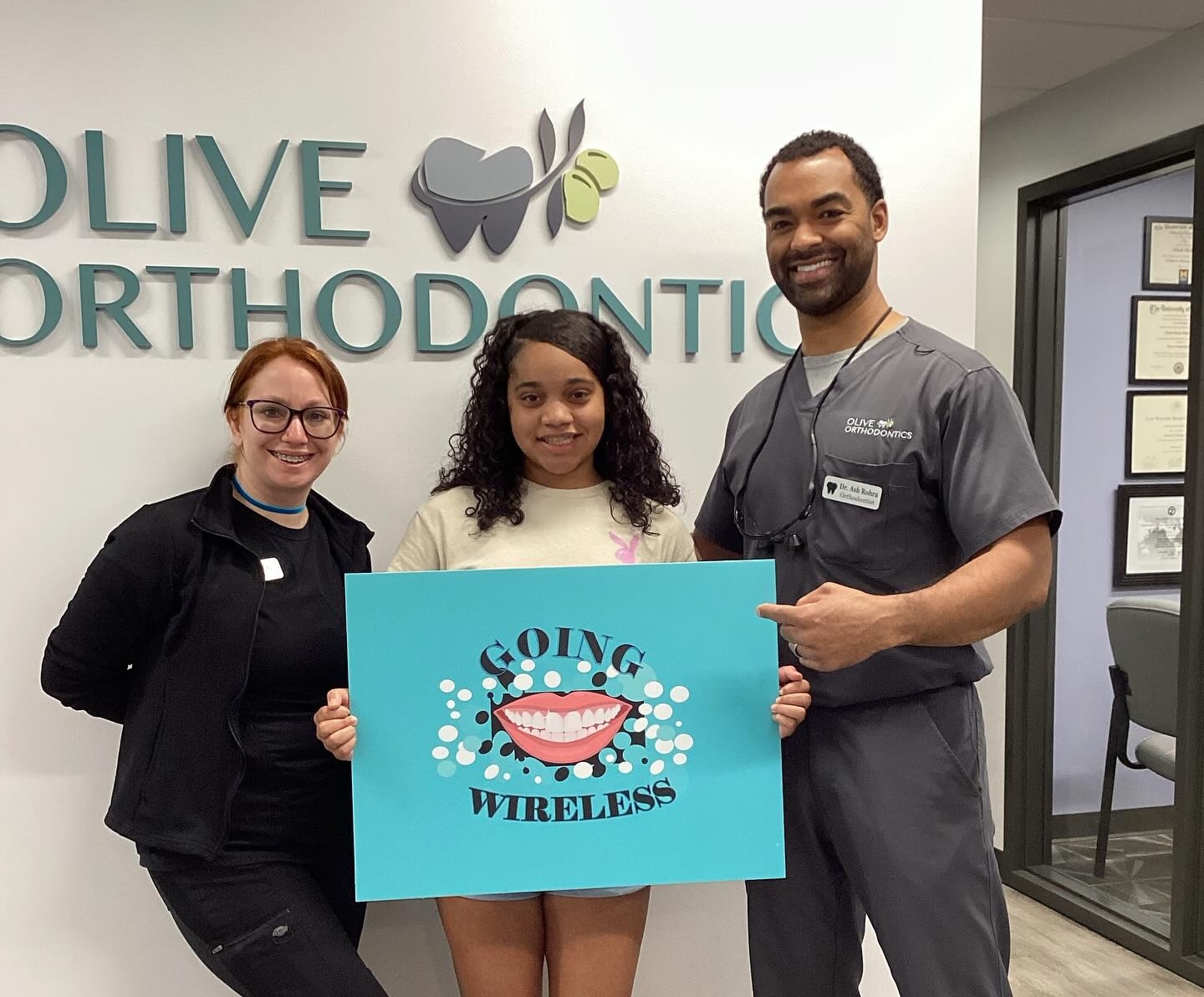 Dr Rohra And Staff Member With Smiling Patient